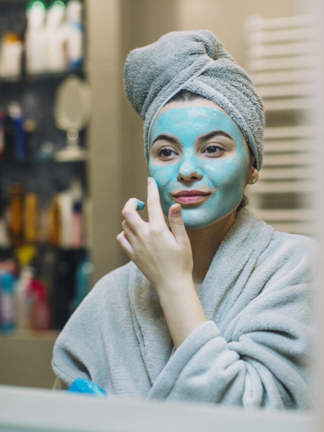 young-woman-applying-blue-mask